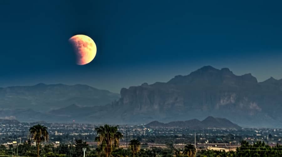 Mega Moon/Eclipse rises above the Superstition Mountains. Mesa, Az