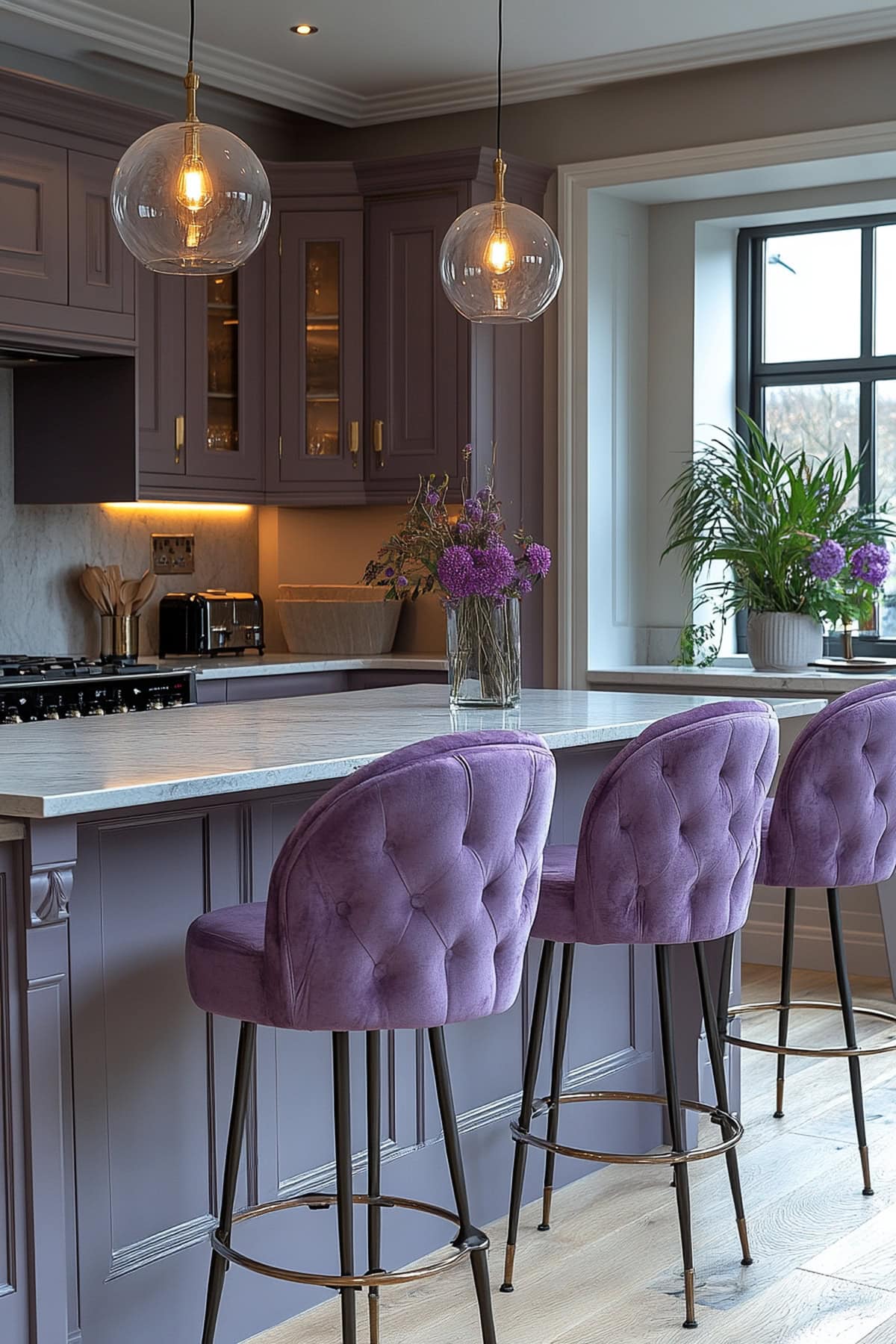 A kitchen with lavender seating and cozy lighting in an apartment